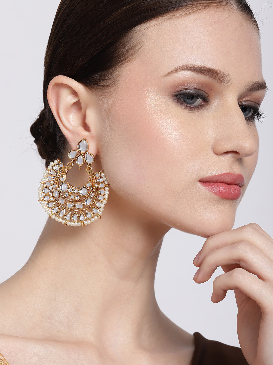 Jewels Galaxy White Antique Gold-Plated Stone-Studded & Beaded Crescent Shaped Chandbalis