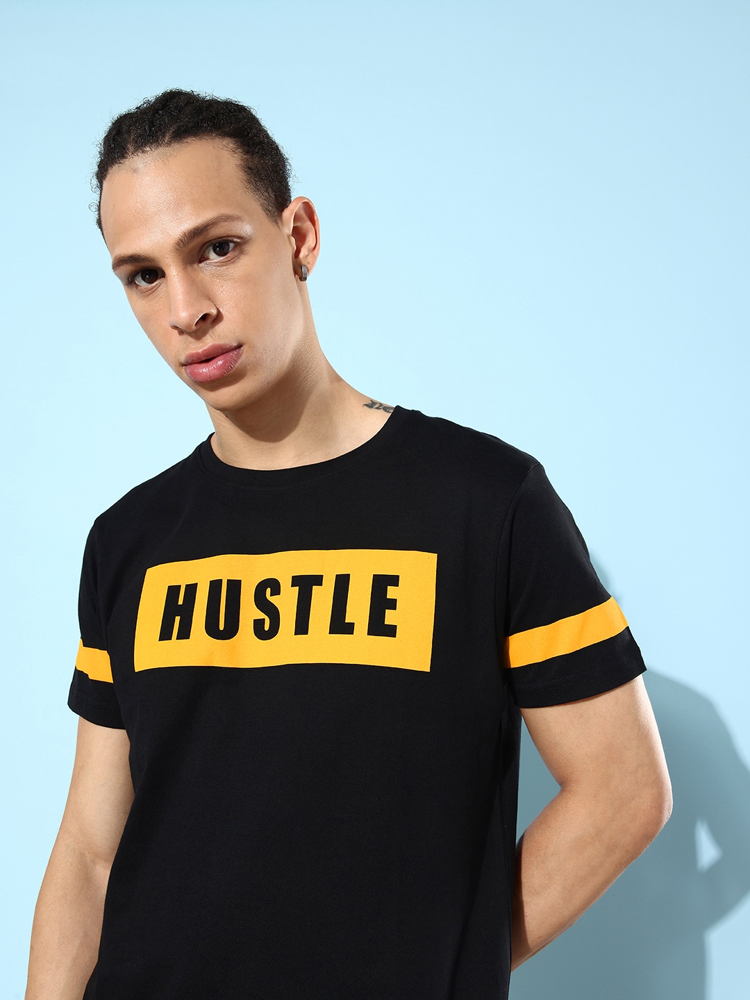 Black t shirt shop with yellow print