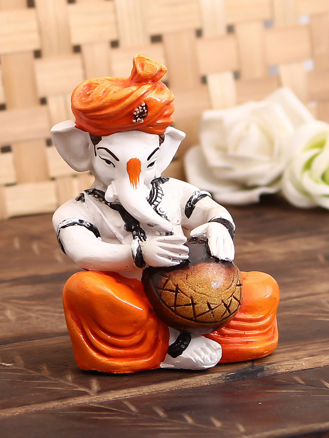 eCraftIndia Lord Ganesha Playing Tabla Orange Polyresin Glossy Prayer Room Small Showpiece - 4.7 Inches