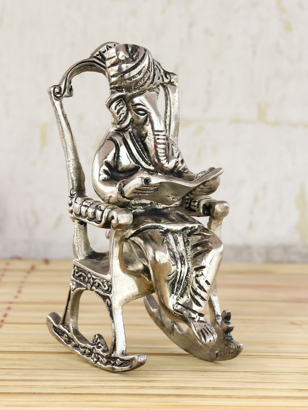 eCraftIndia Lord Ganesha on Rocking Chair Silver Metal Metallic Prayer Room Small Showpiece - 5.9 Inches