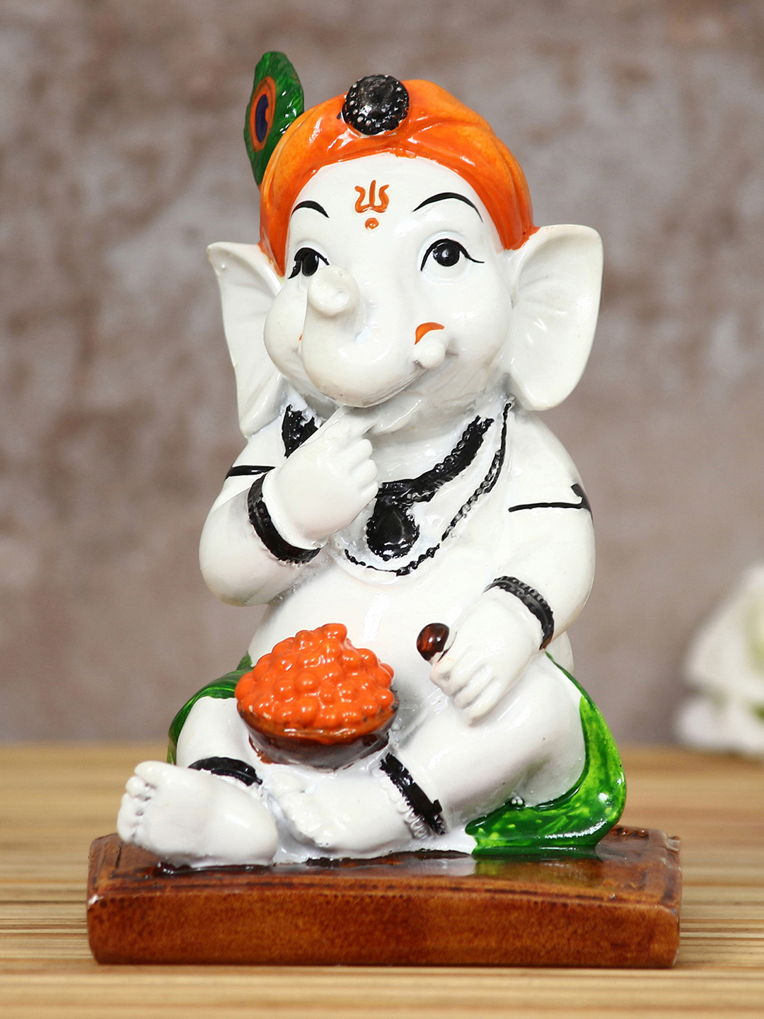 eCraftIndia Lord Ganesha Eating Ladoo in Lord Krishna Avatar White Polyresin Matte Prayer Room Tiny Showpiece - 5.7 Inches