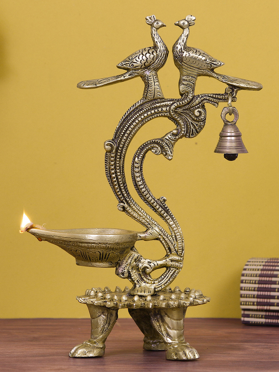 eCraftIndia Gold Toned Brass Peacock Diya With Bells Antique Finish Showpiece