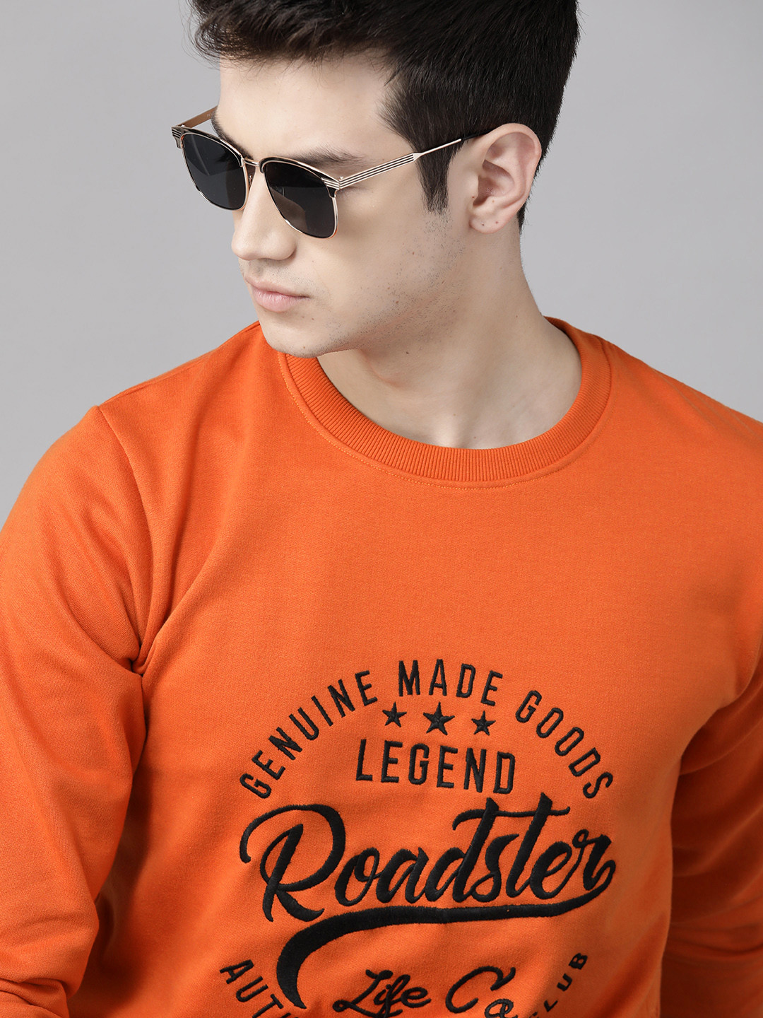 Roadster Men Orange & Black Self Design Sweatshirt