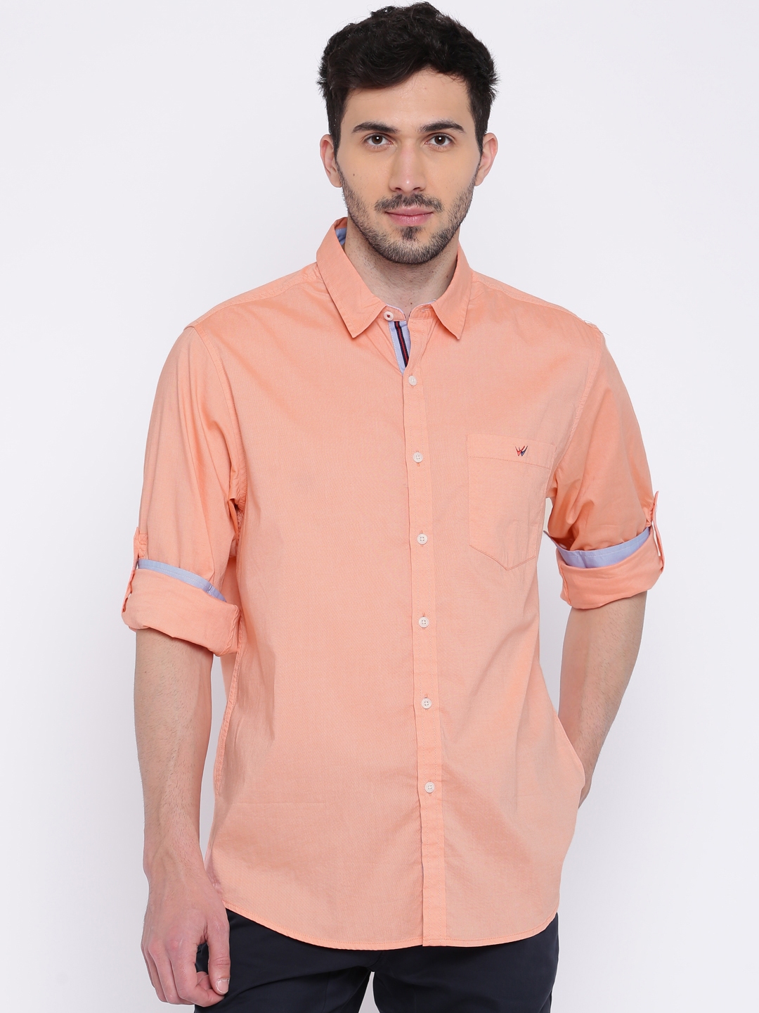 peach color shirt