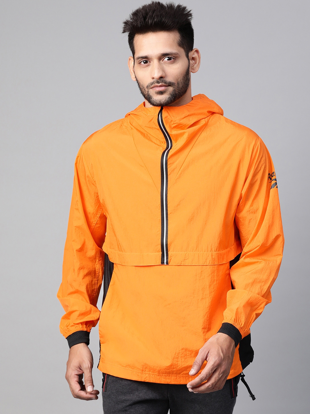Buy Reebok Men Orange Solid Lightweight One Series Running Anorak Jacket Jackets for Men 12616080 Myntra