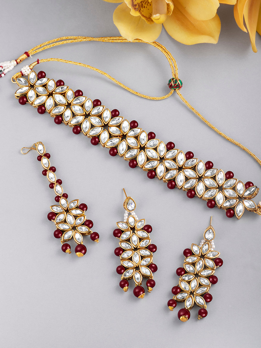 Peora Gold Plated & Maroon Kundan Jewellery Set with Earrings & Maang Tika