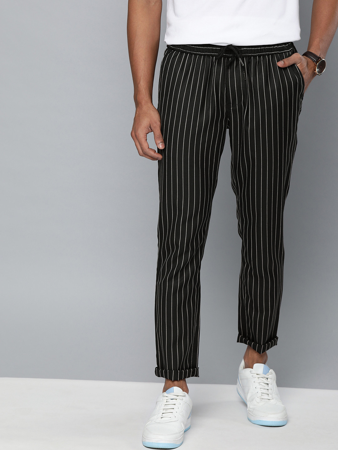white and black striped trousers