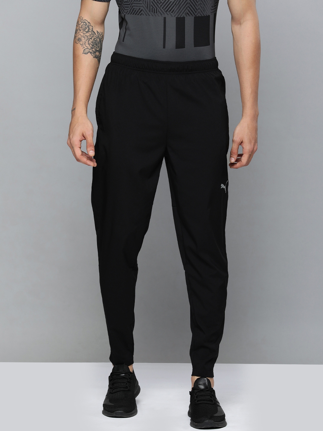 Buy Puma Men Black Brand Logo Printed Tapered Fit Drycell Track Pants Track Pants for Men 13501916 Myntra
