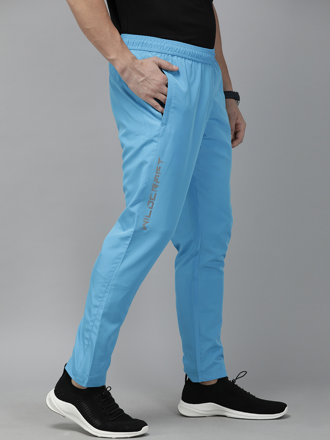 Wildcraft Men Blue Solid Straight Fit Track Pants With Printed Detail