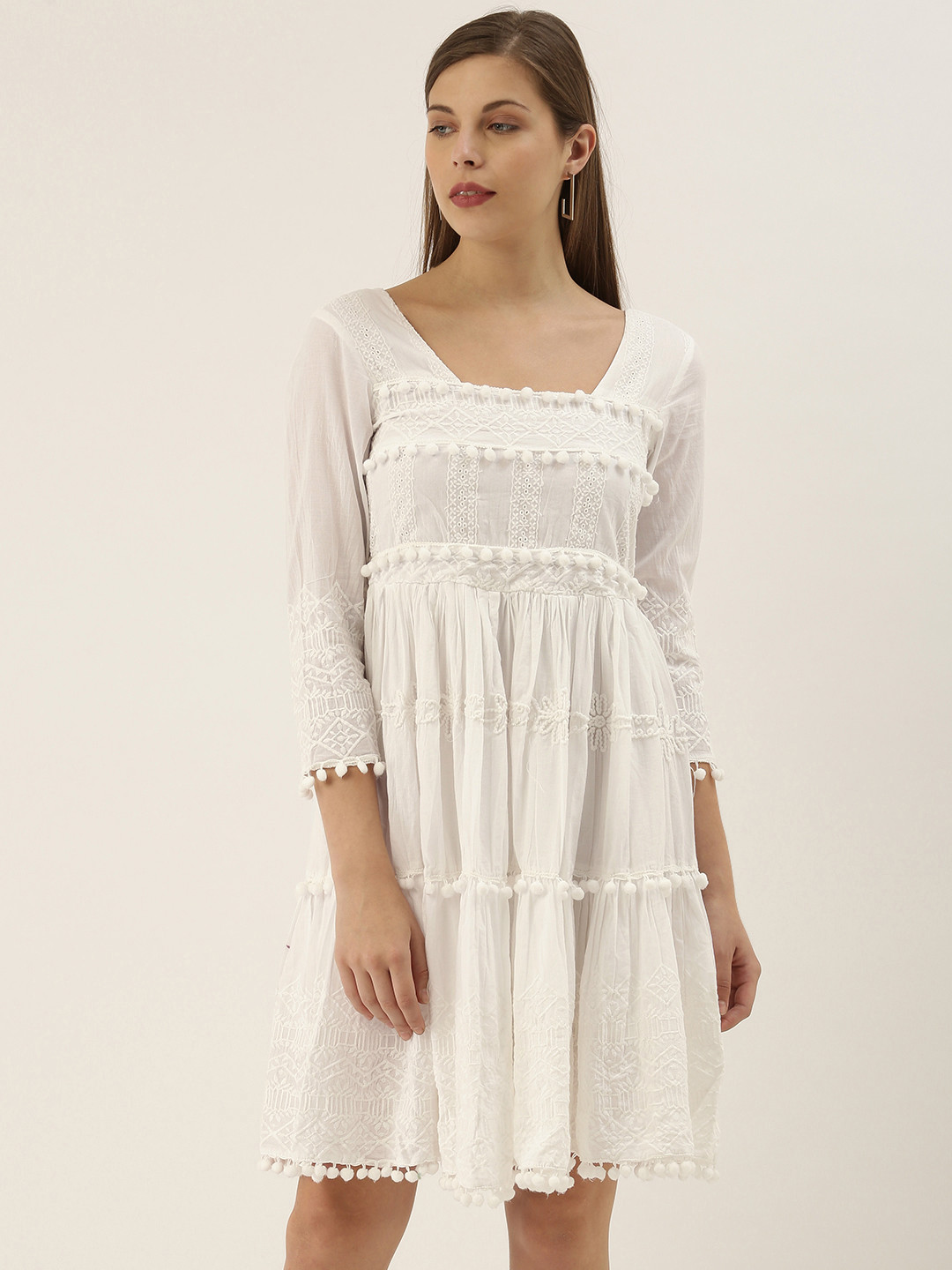 Saanjh Women White Embroidered Tiered Fit and Flare Dress With Pom Pom Detailing