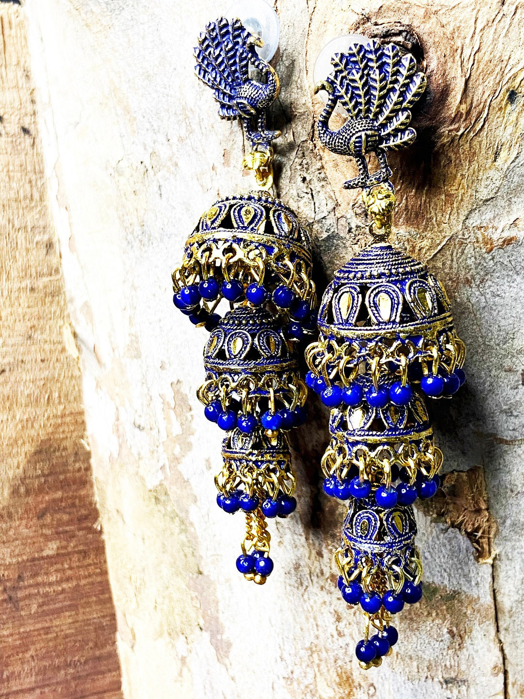 ANIKAS CREATION Gold-Plated & Blue 3 Layer Traditional Peacock Shaped Jhumkas