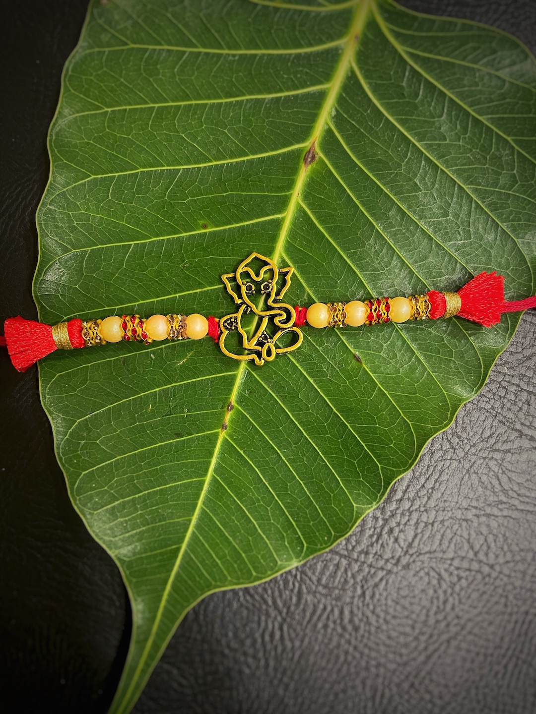 Digital Dress Room Red & Gold-Toned Ganesh Ji Pendant Mauli Rakhi