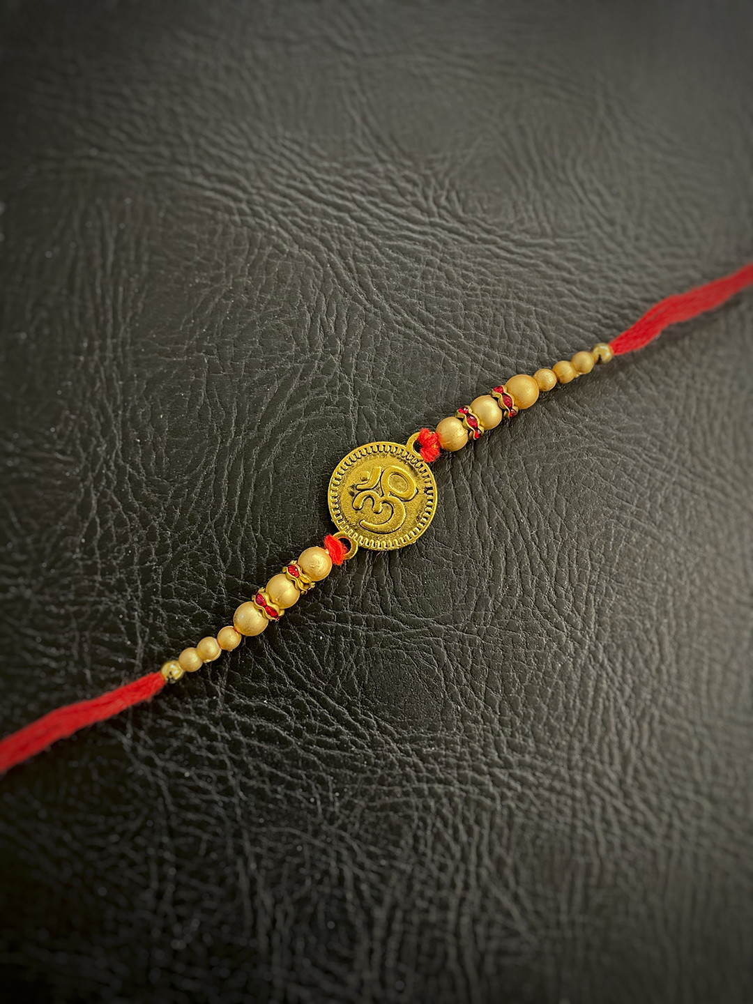 Digital Dress Room Red & Gold-Toned Beaded Rakhi with OM Pendant