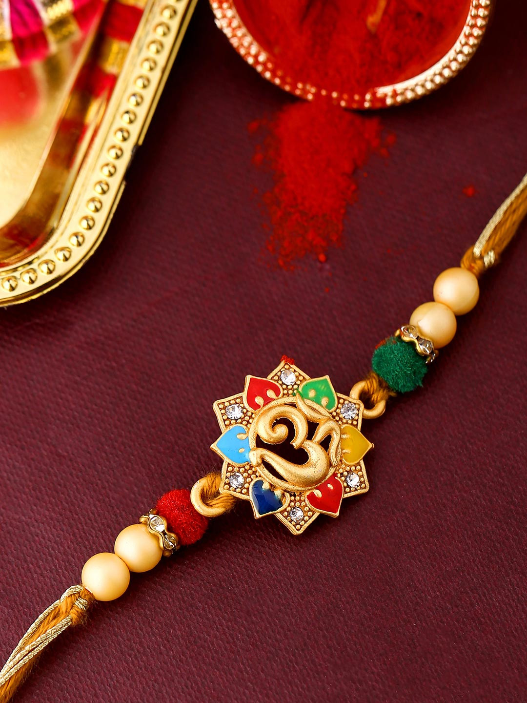 Rudraksha OM enamelled Rakhi With Roli Chaawal Pack | Voylla Rakhi