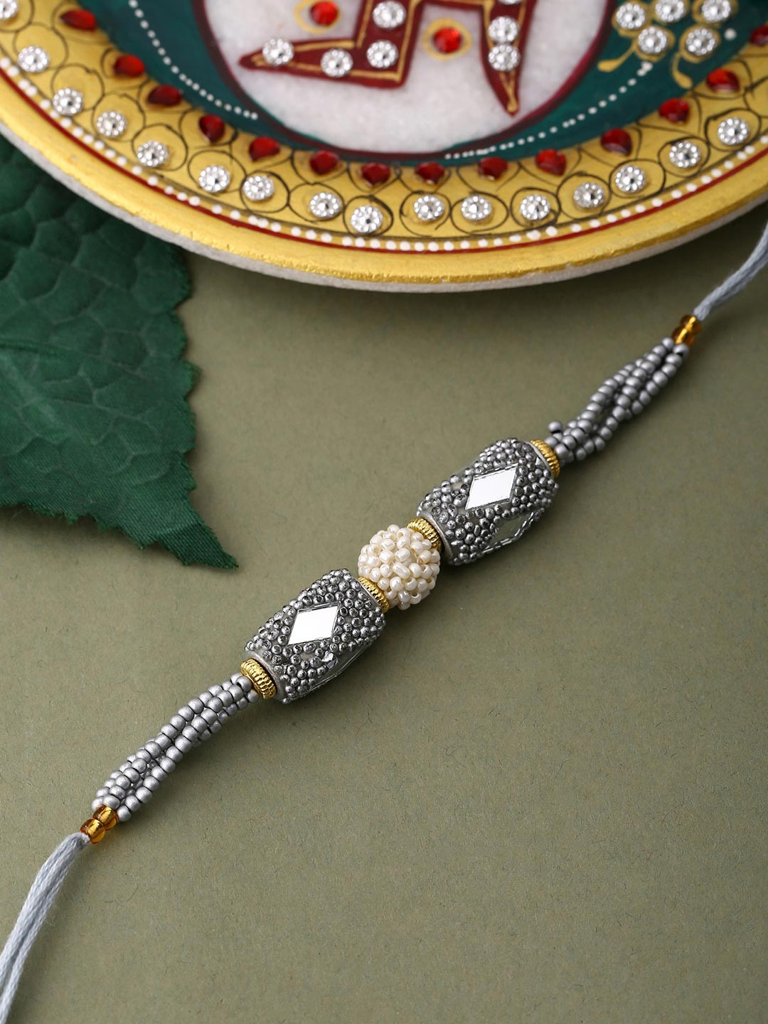 Voylla Unisex Silver Beaded and Pearls Rakhi with Roli Chaawal Pack