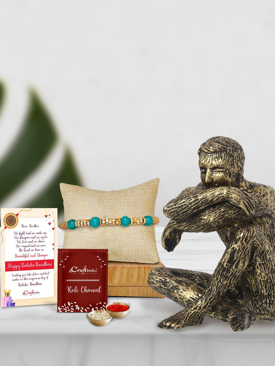 eCraftIndia Gold-Toned Pearl Rakhi & Decorative Statue with Roli Chawal & Card