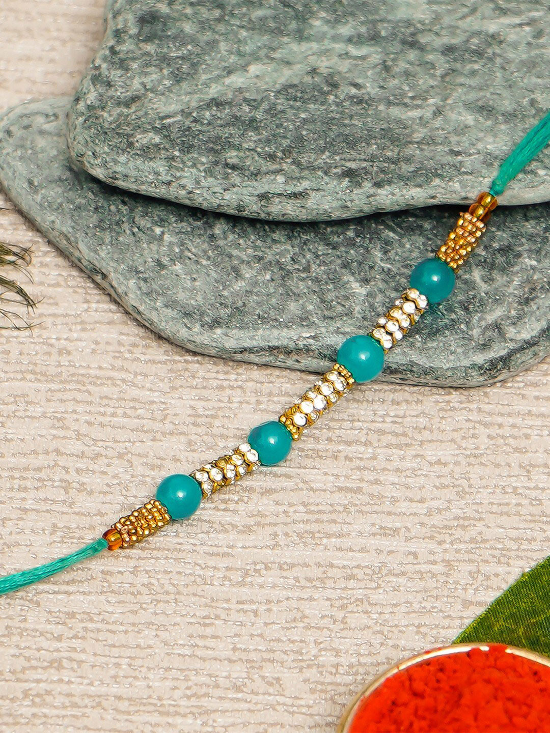 eCraftIndia Gold-Toned & Sea Green Designer Pearl Rakhi & Roli Chawal Pack