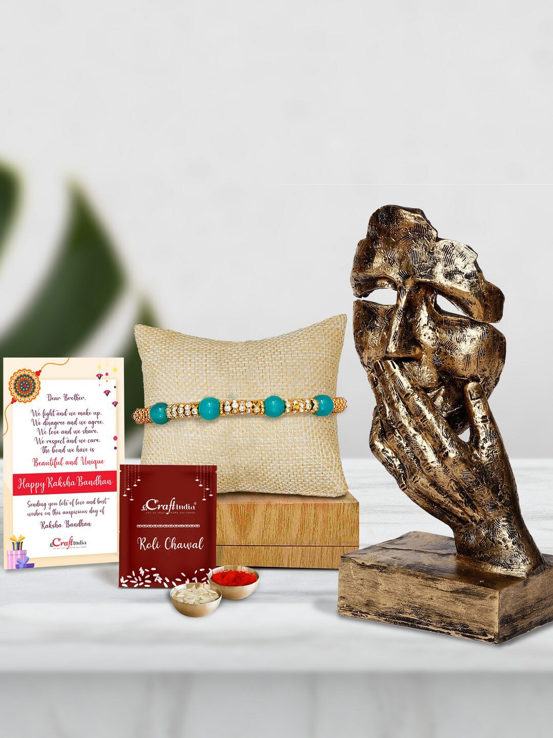 eCraftIndia Multicoloured Pearl Rakhi with Polyresin Face Showpiece Gift Set