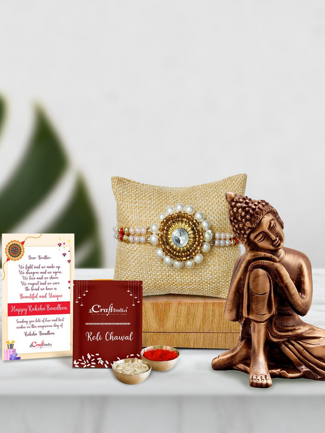eCraftIndia Gold-Toned & White Pearl Buddha Resting Idol Rakhi Gift Set