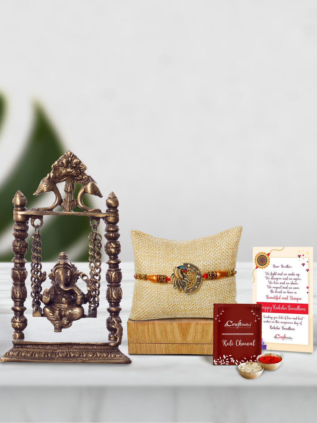 eCraftIndia Multicoloured Peocock Rakhi with Brass Lord Ganesha on Jhoola Gift Set
