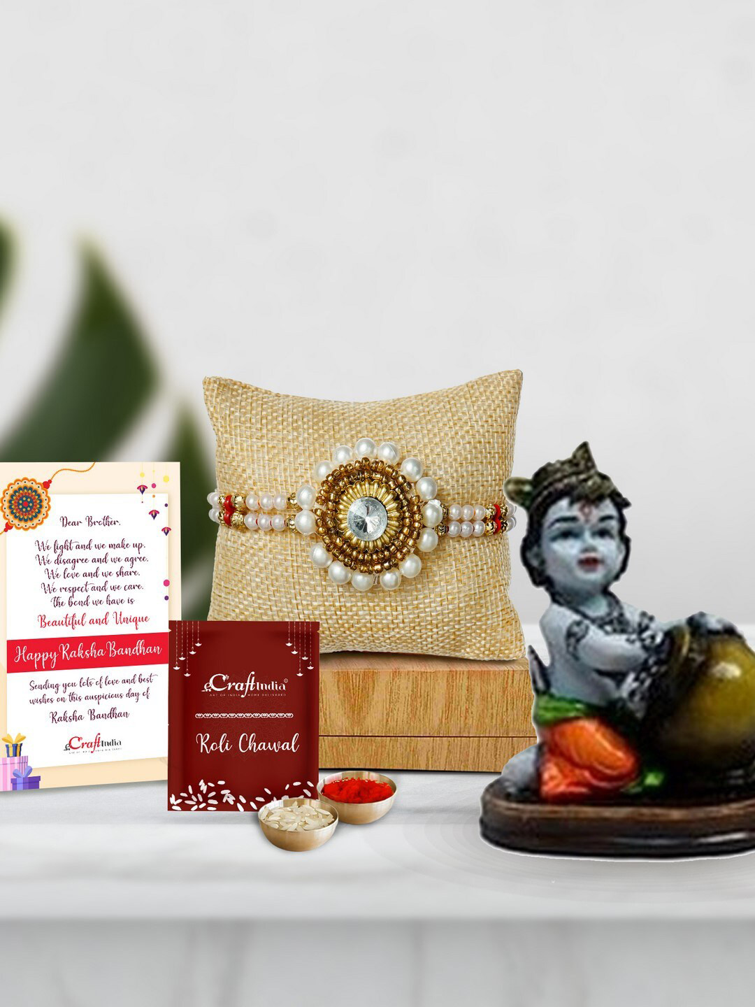 eCraftIndia Gold-Toned & White Makhan Chor Showpiece Pearl Beaded Rakhi Gift Set