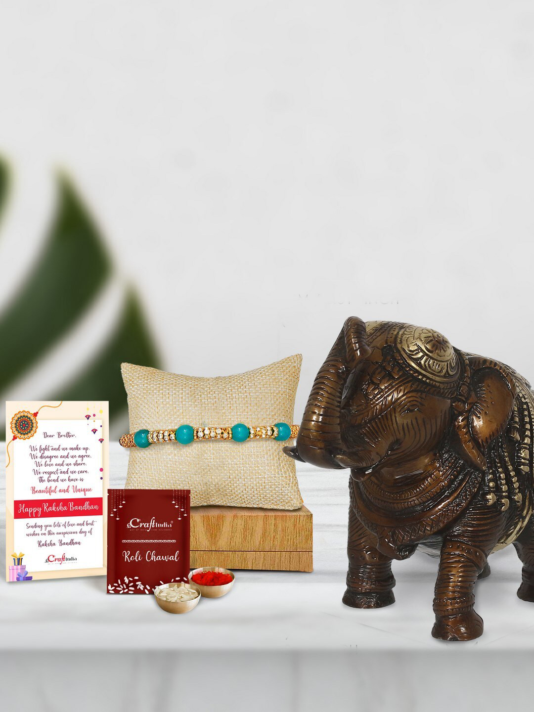 eCraftIndia Multicoloured Pearl Rakhi with Antique Brass Elephant Fingurine Gift Set