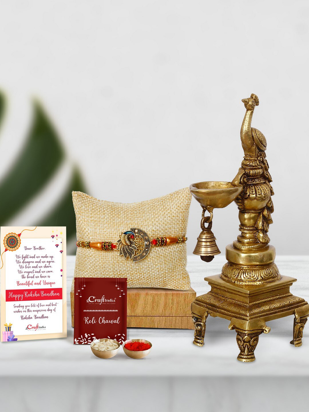 eCraftIndia Multicoloured Peocock with Brass Hanging Diya With Stand Rakhi Gift Set