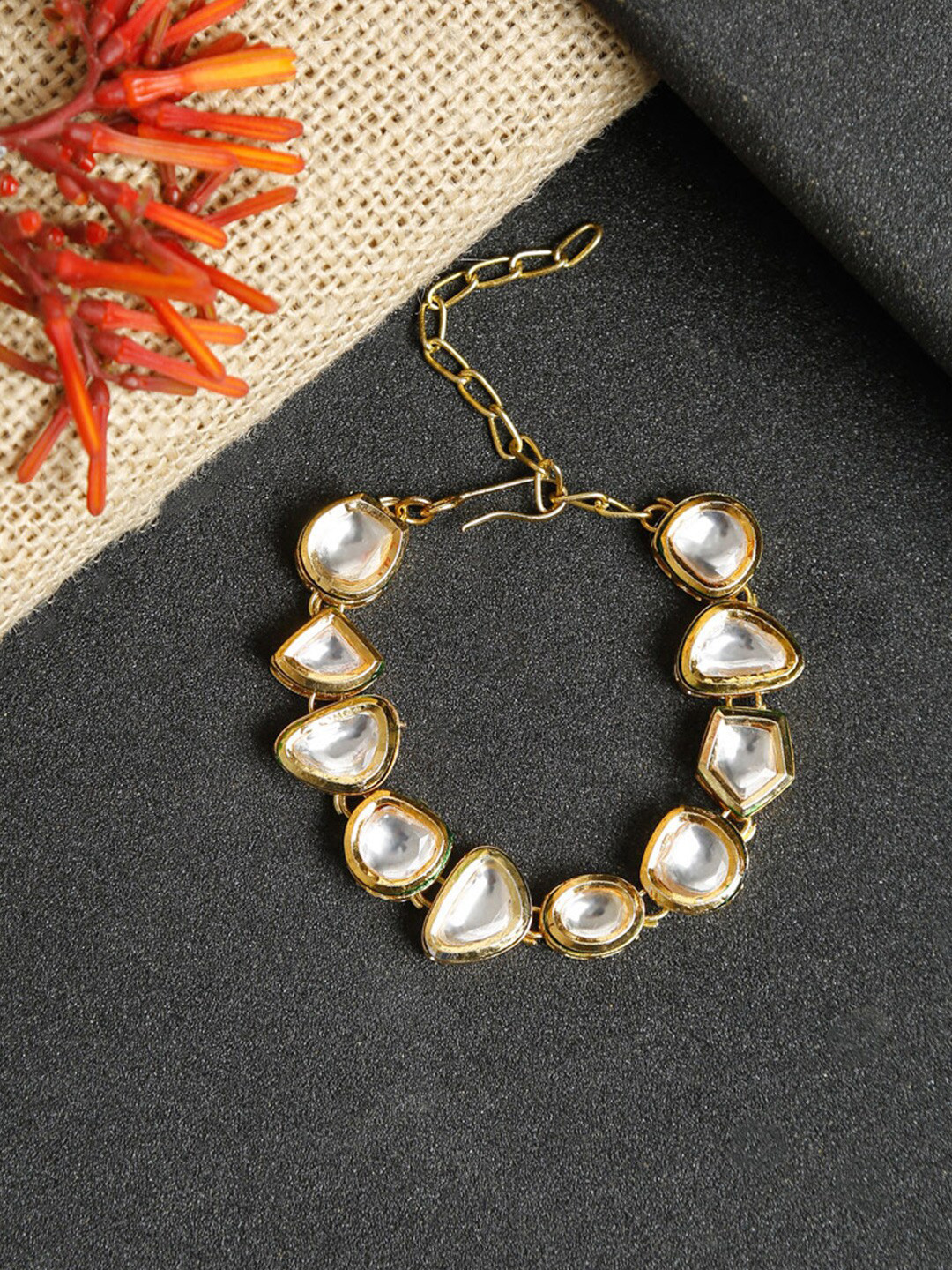 Ruby Raang Women Gold-Toned & White Kundan Charm Bracelet