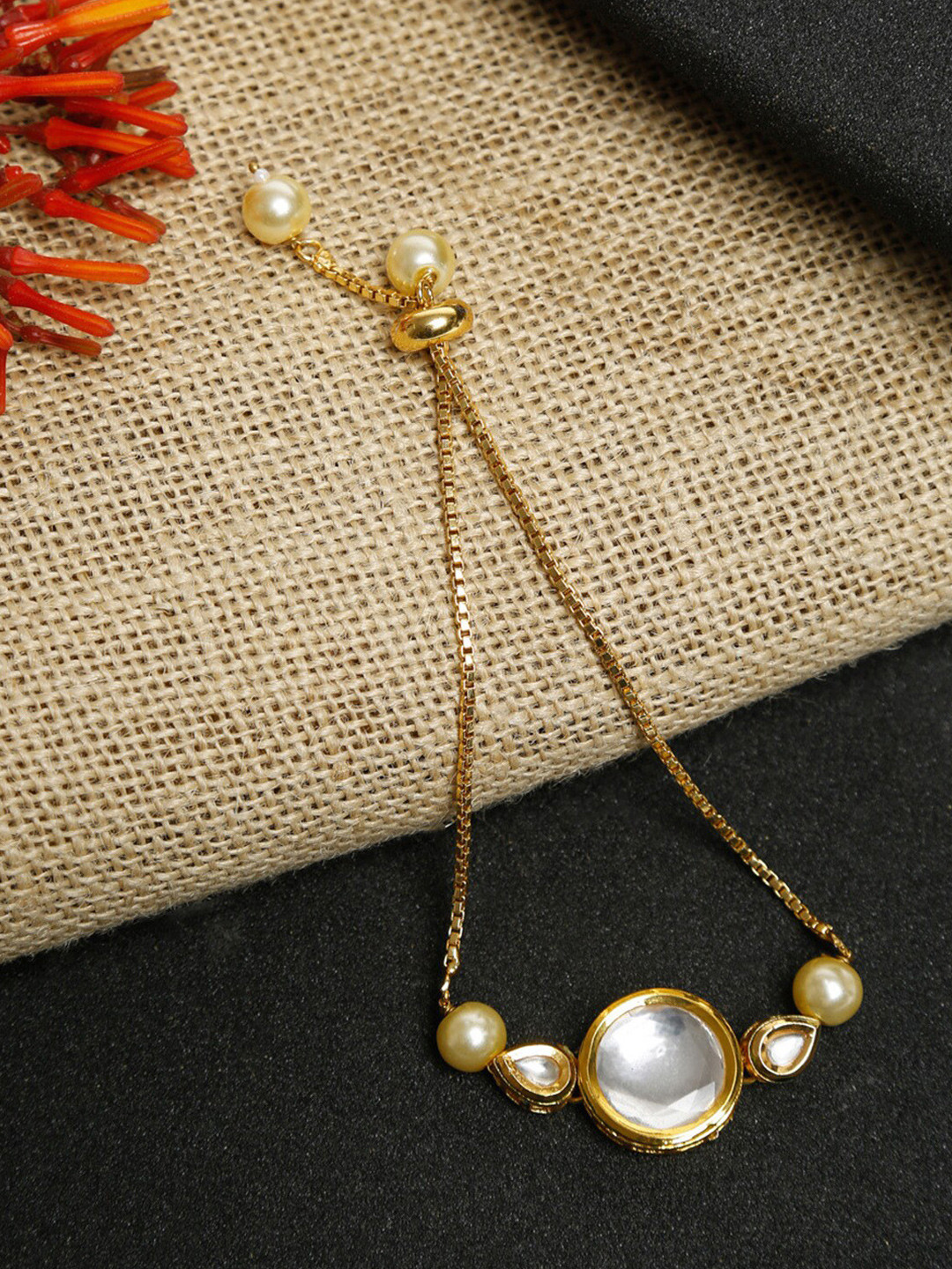 Ruby Raang Women Gold-Toned & White Kundan Charm Bracelet