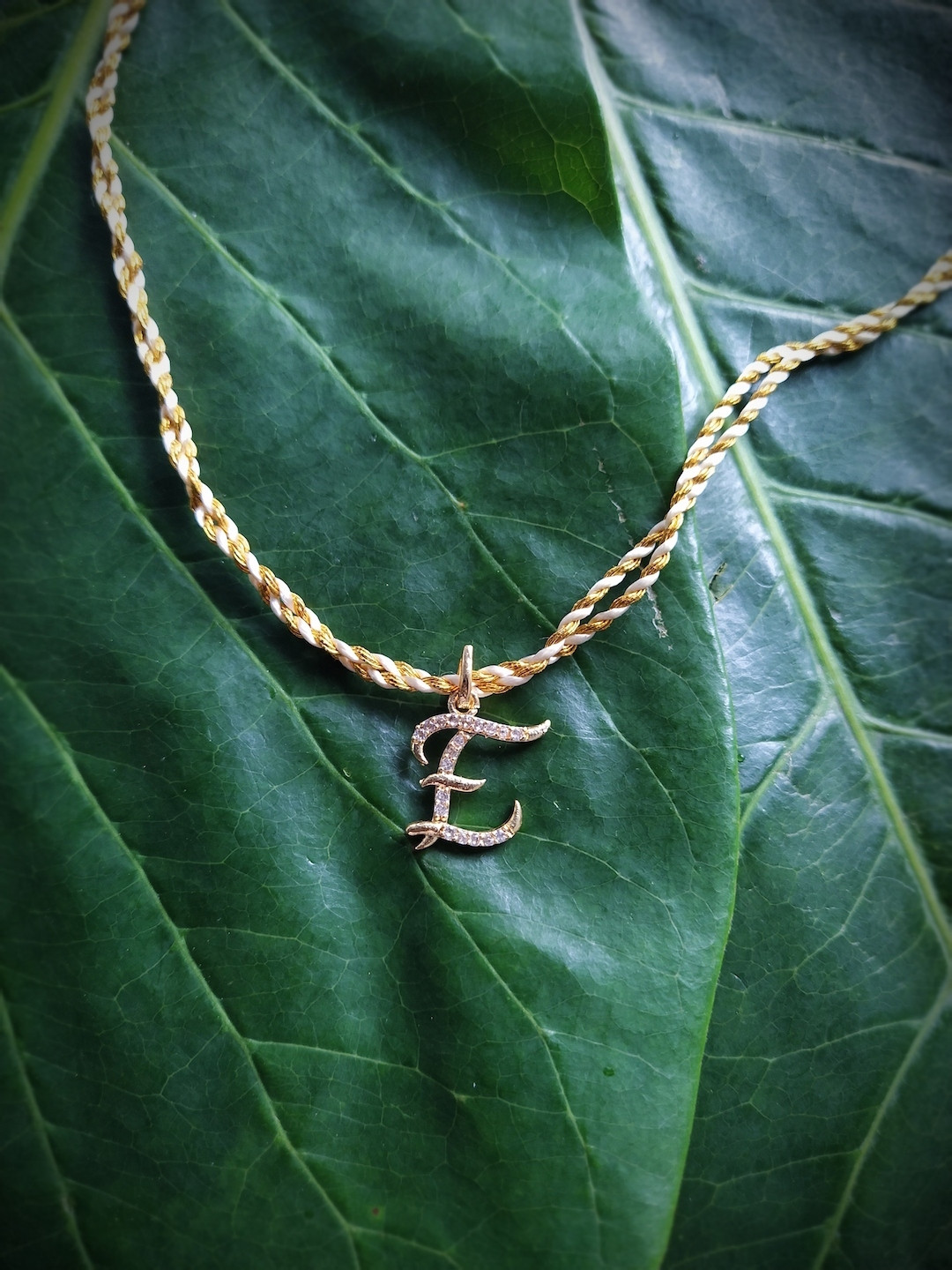 Digital Dress Room Men Gold-Plated & Cream-Coloured AD-Studded Alphabet E Rakhi