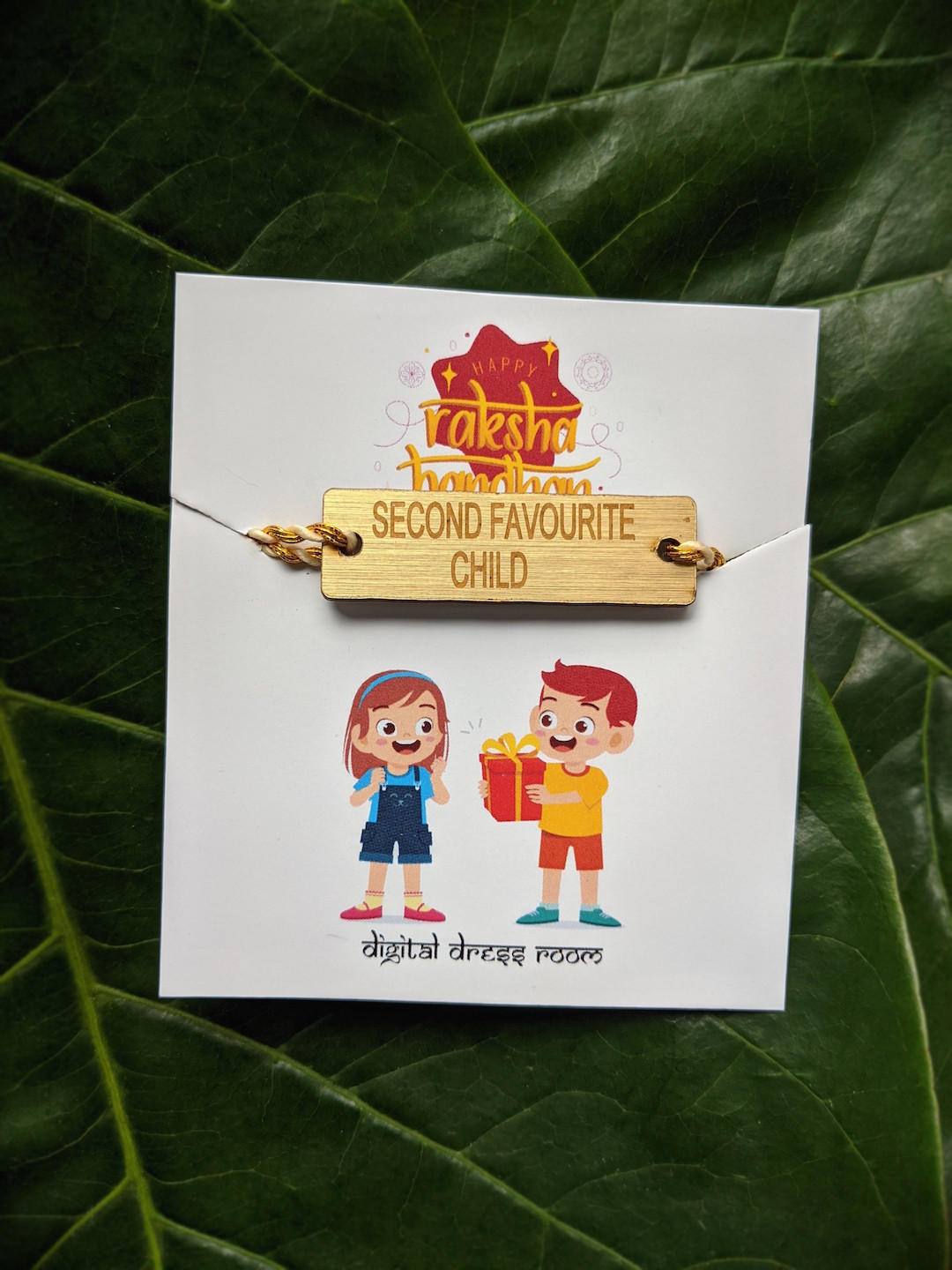 Digital Dress Room Men Cream-Coloured & Gold-Toned Funky Slogan Second Favourite Child Rakhi