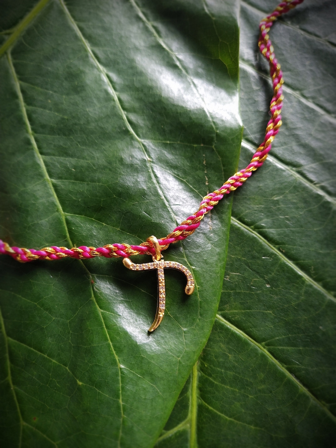 Digital Dress Room Pink Gold-Plated AD-Studded Alphabet T Charm Rakhi