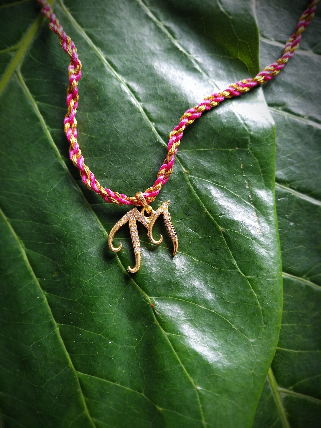 Digital Dress Room Men Gold-Plated Pink & Beige AD-Studded Letter M Rakhi