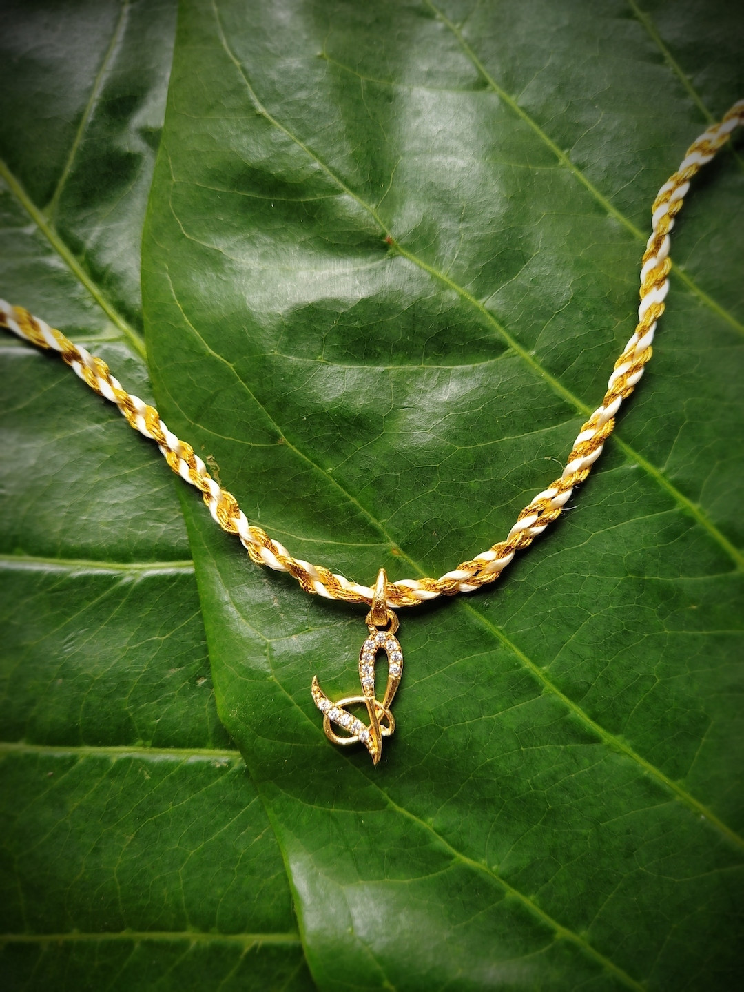 Digital Dress Room Unisex Gold-Plated Cream-Coloured AD-Studded Letter V Rakhi