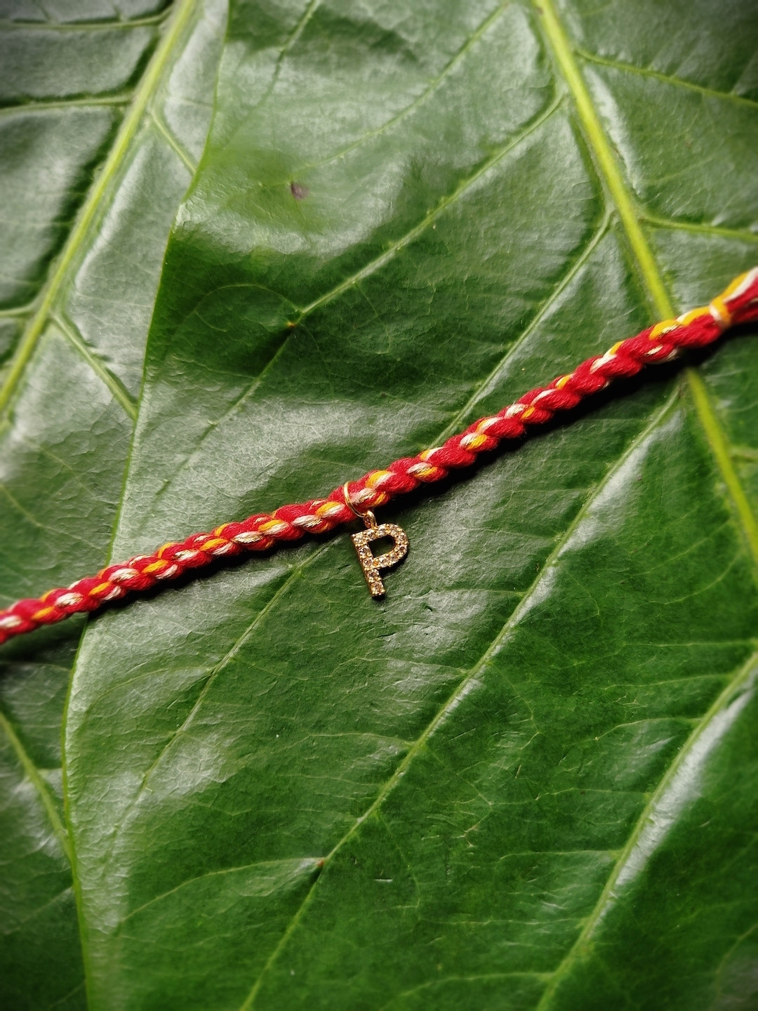 Digital Dress Room Men Gold-Plated Red & Yellow AD-Studded Letter P Charmed Rakhi