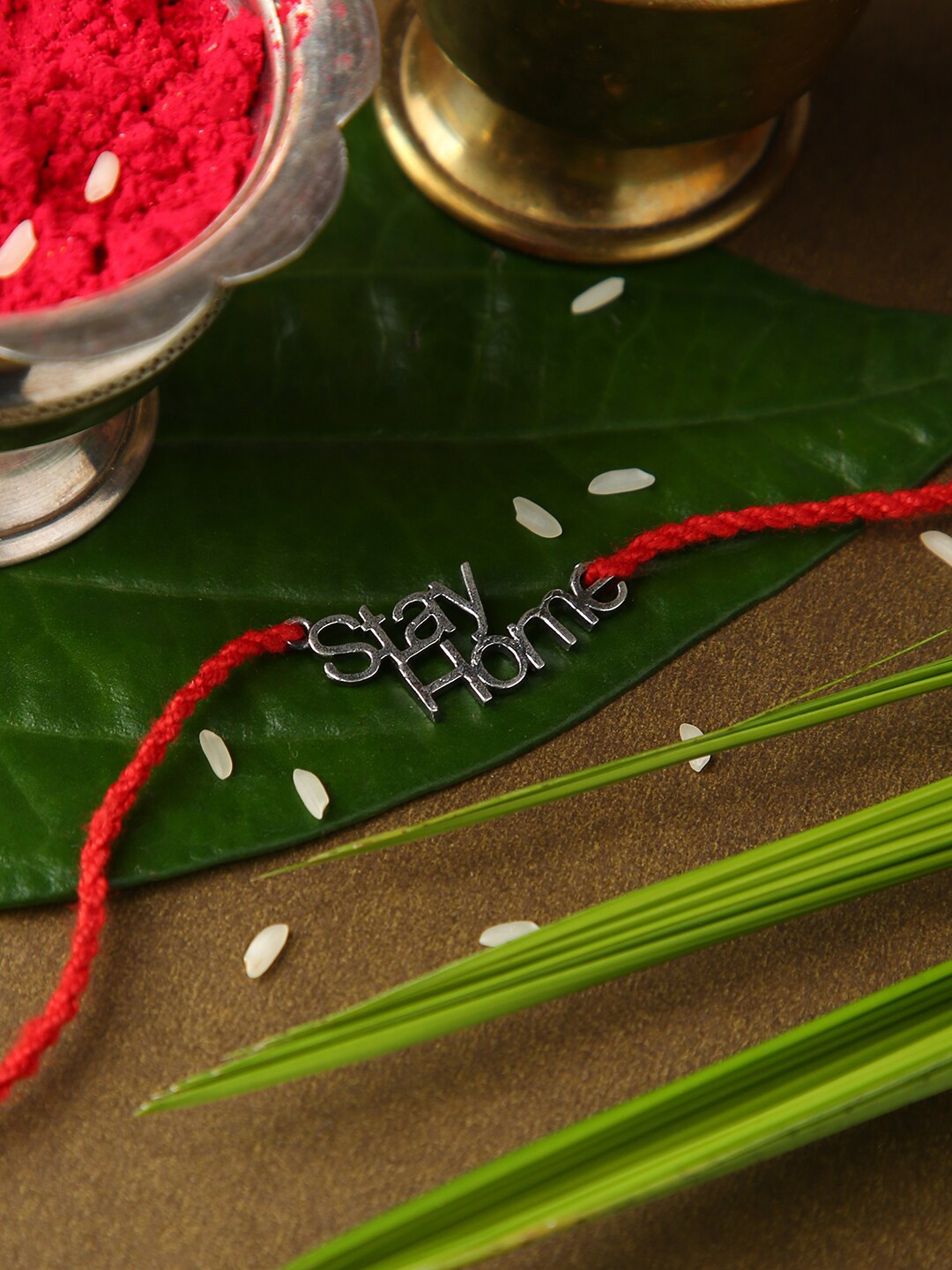 justpeachy Silver-Toned & Red Rakhi With Roli and Akshada