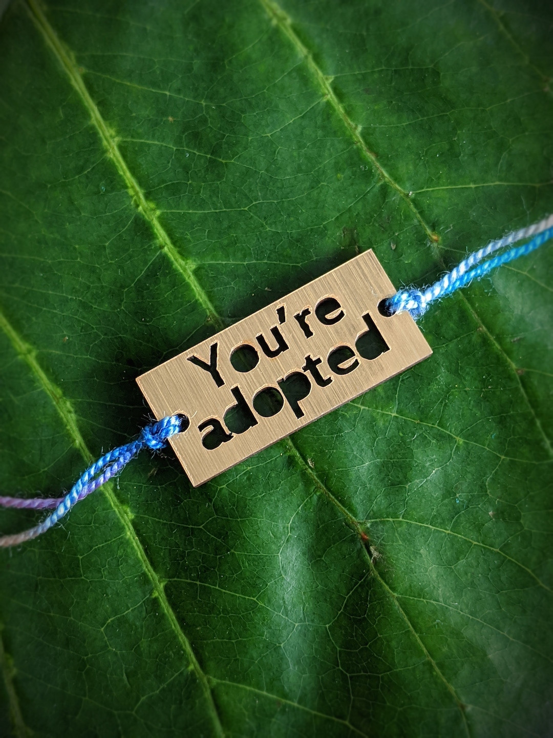 Digital Dress Room Gold & Blue You're Adopted Charm Mauli Rakhi