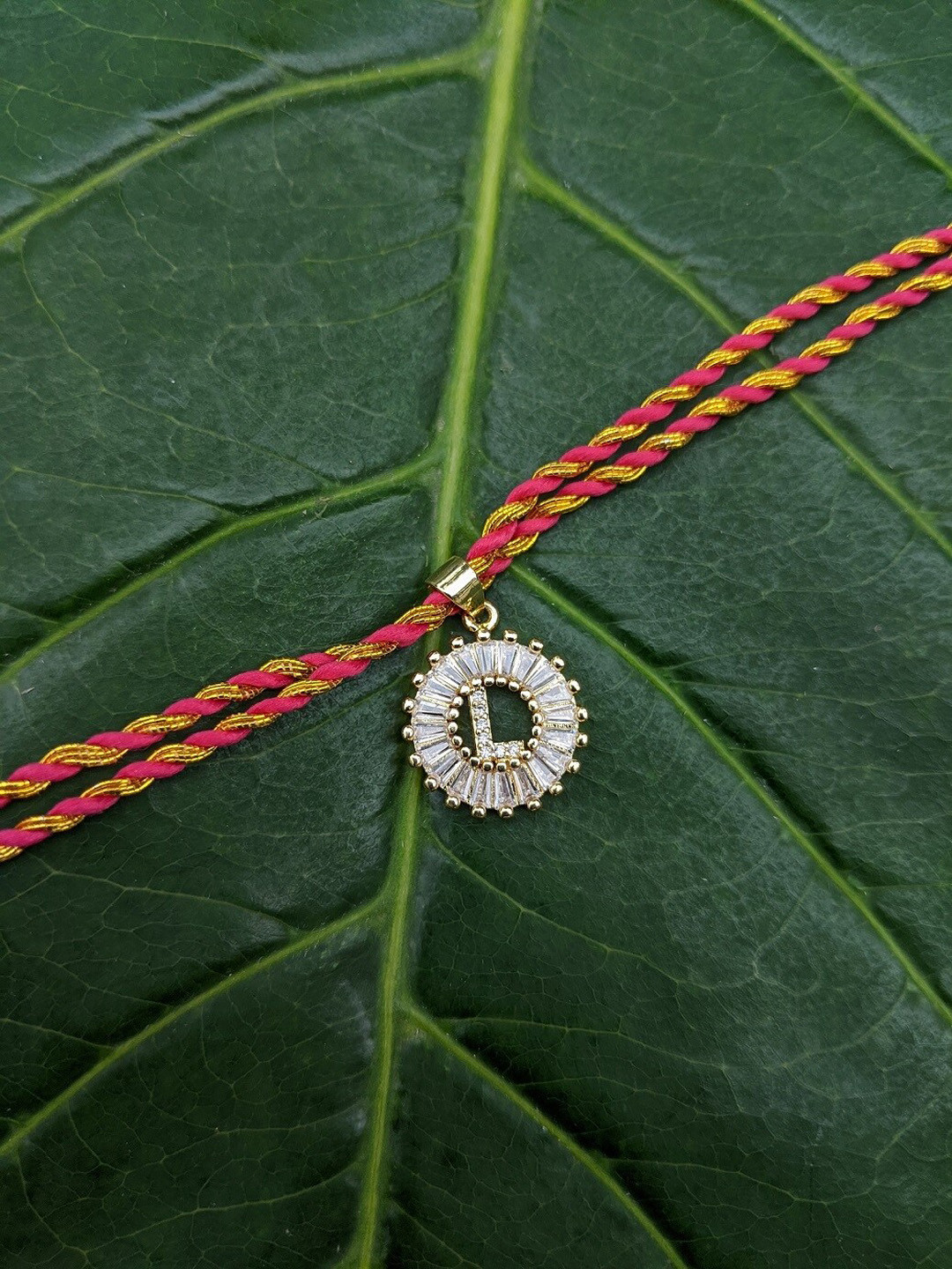 Digital Dress Room Gold-Plated Orange & White AD-Studded L Alphabet Customized Thread Rakhi