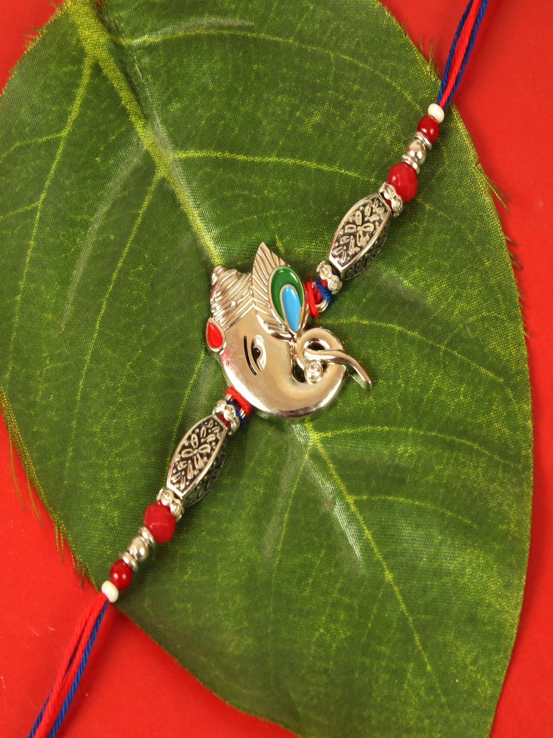 TIED RIBBONS White & Gold-Toned Ganesha Rakhi with Roli Chawal