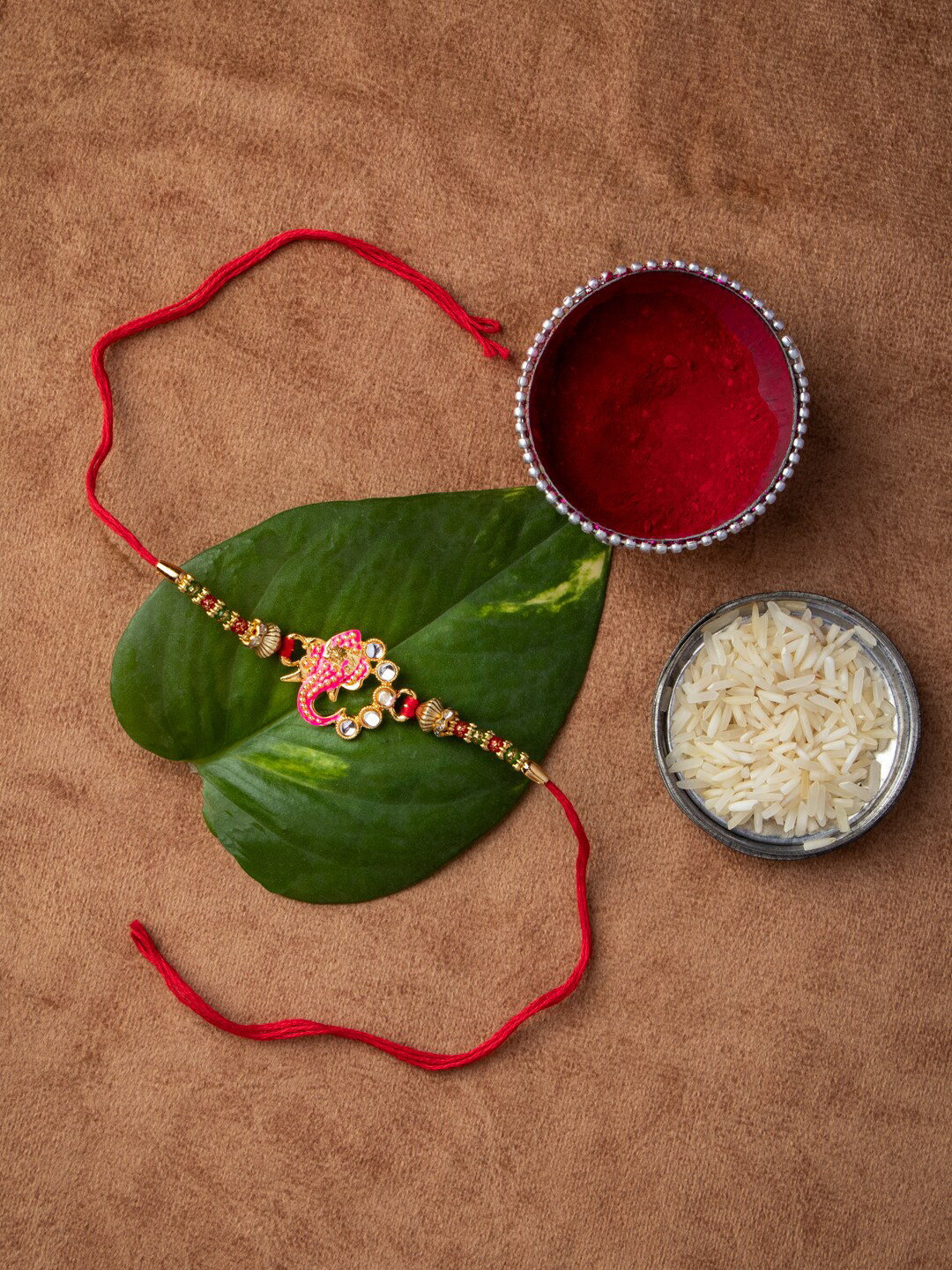 MORKANTH JEWELLERY Gold-Toned & Stone-Studded Ganesha Brass Handcrafted Rakhi