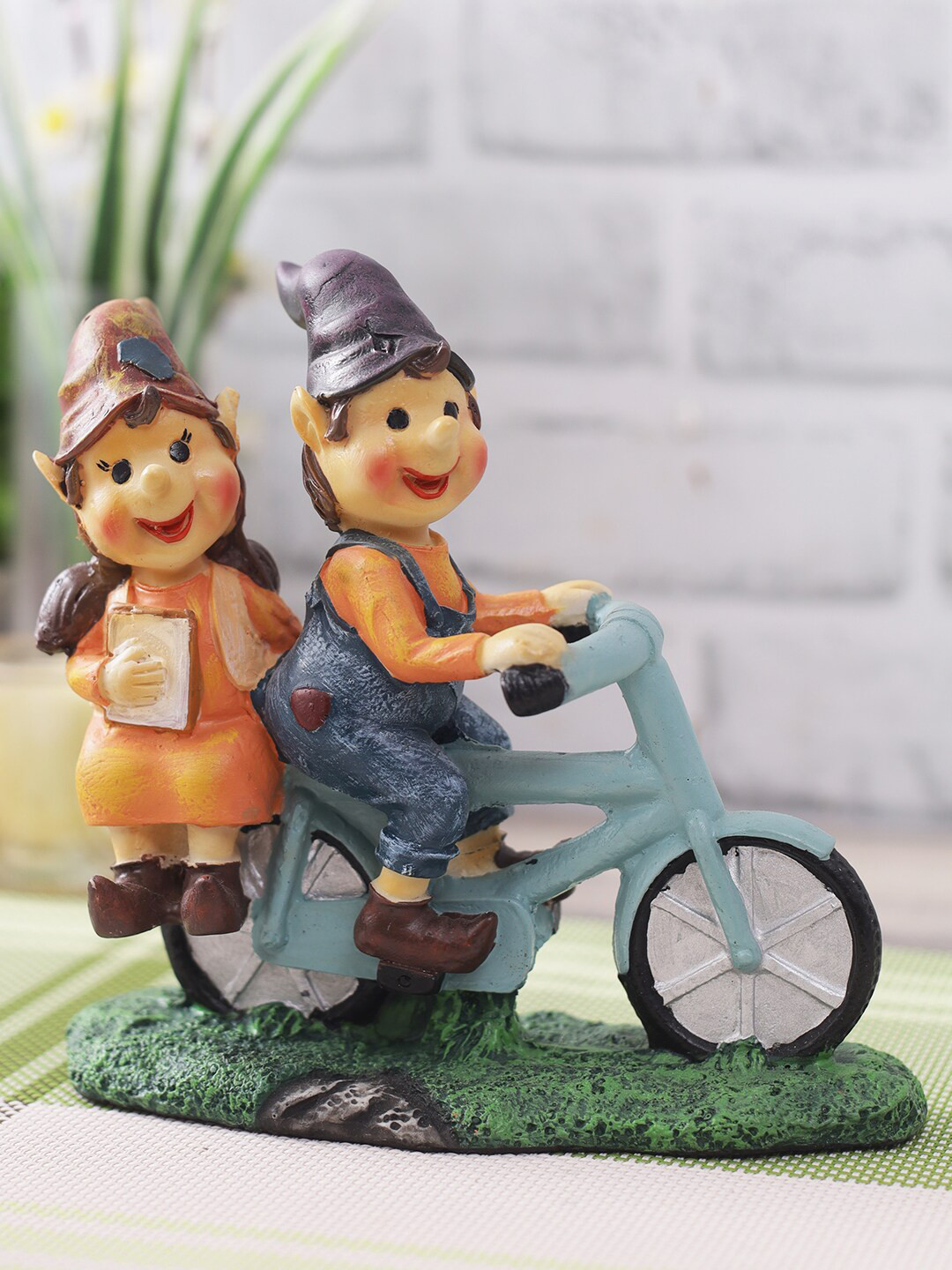 CraftVatika Cute Romantic Love Couple on Cycle Orange Polyresin Matte Living Room Small Showpiece - 6.5 Inches
