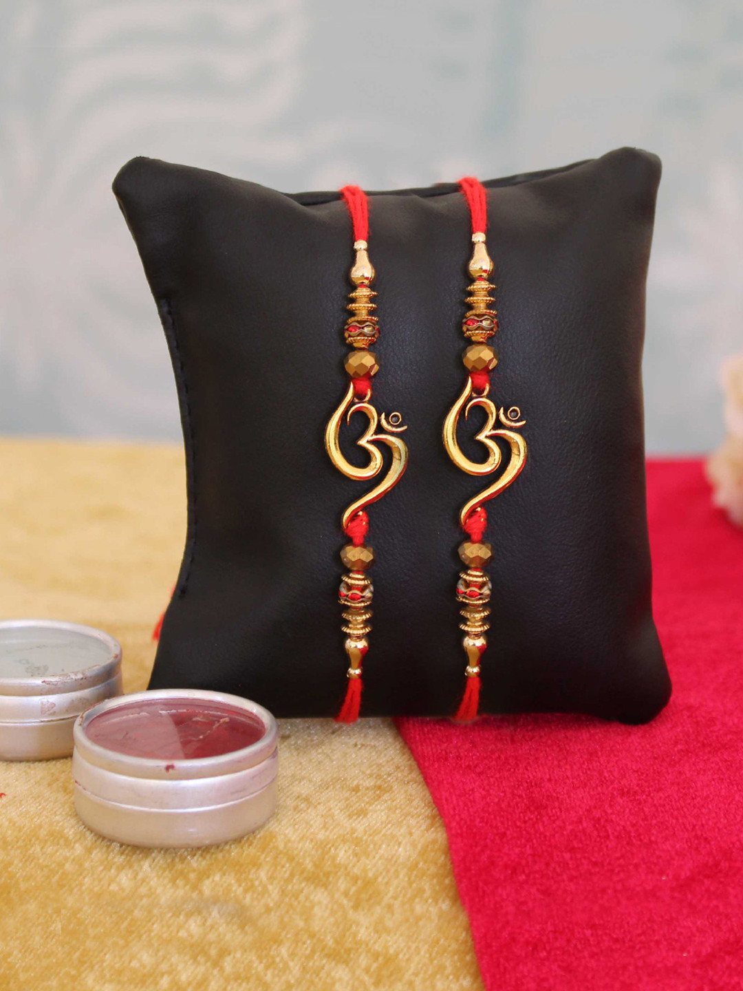 TIED RIBBONS Set of 2 Multicoloured Handmade Om Rakhi with Roli Chawal