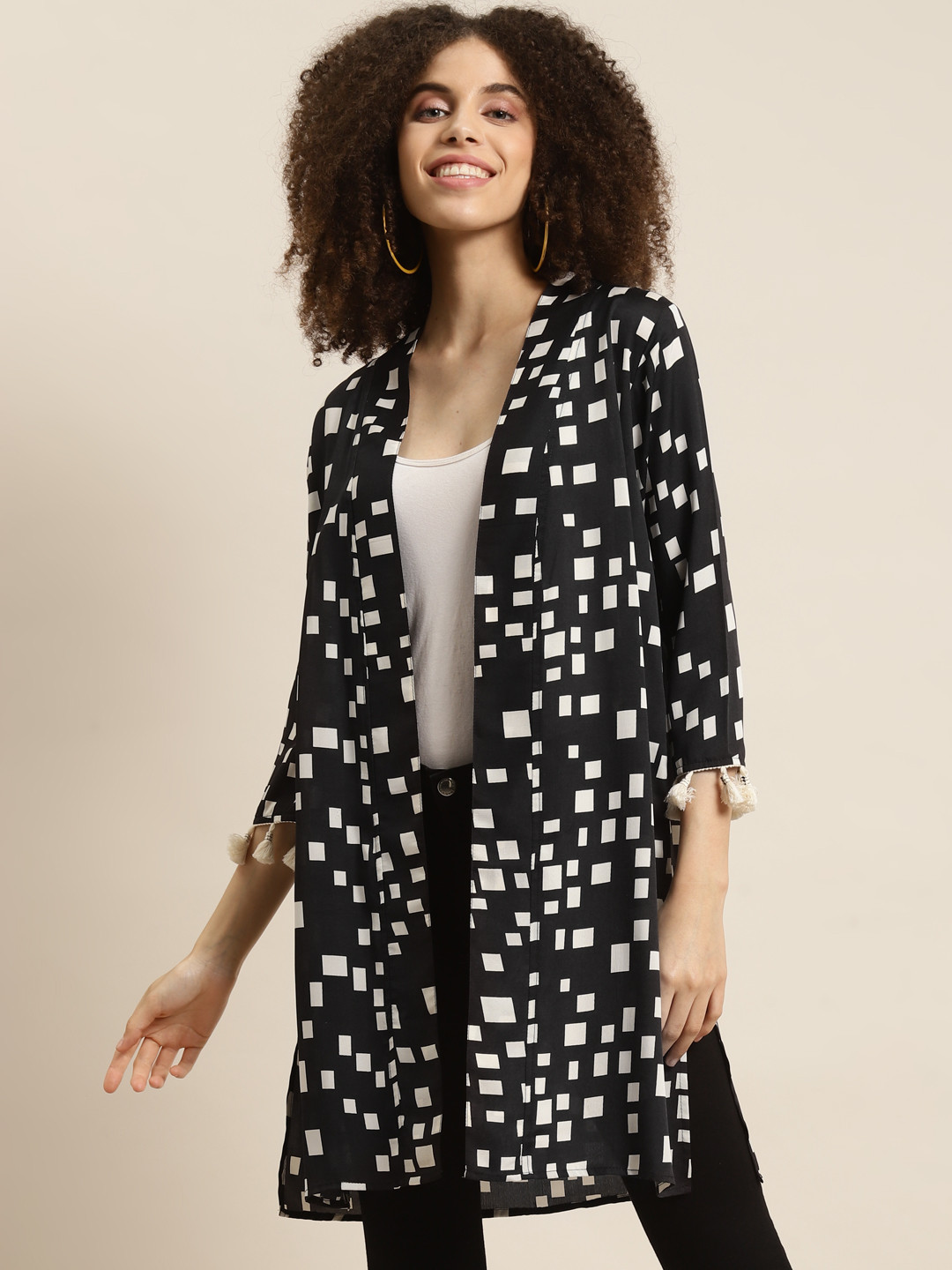 Qurvii Women Black & White Printed Tasselled Longline Shrug