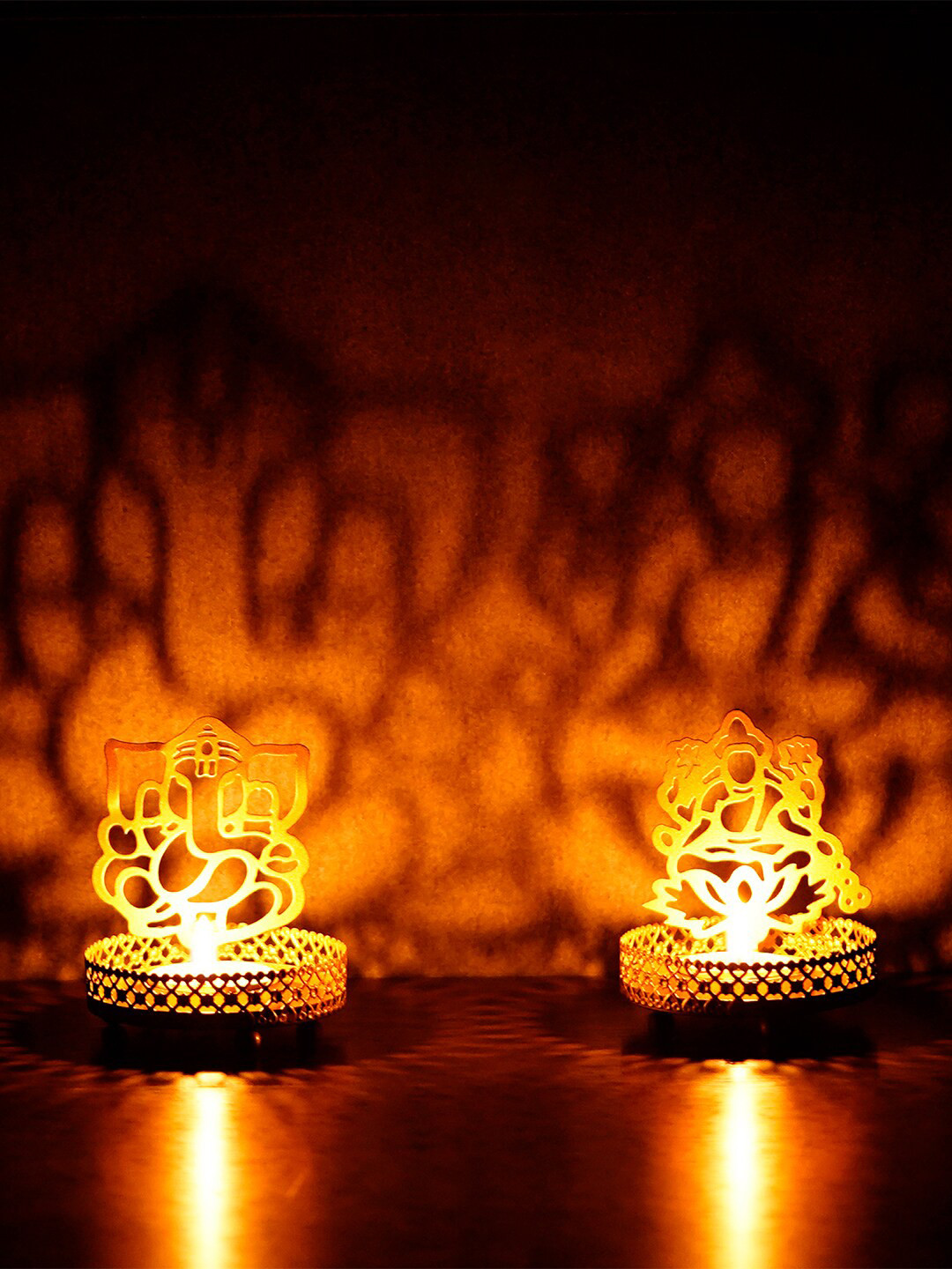 eCraftIndia Set Of 2 Gold-Toned Handcrafted Ganesha & Laxmi Shadow Tea Light Holders