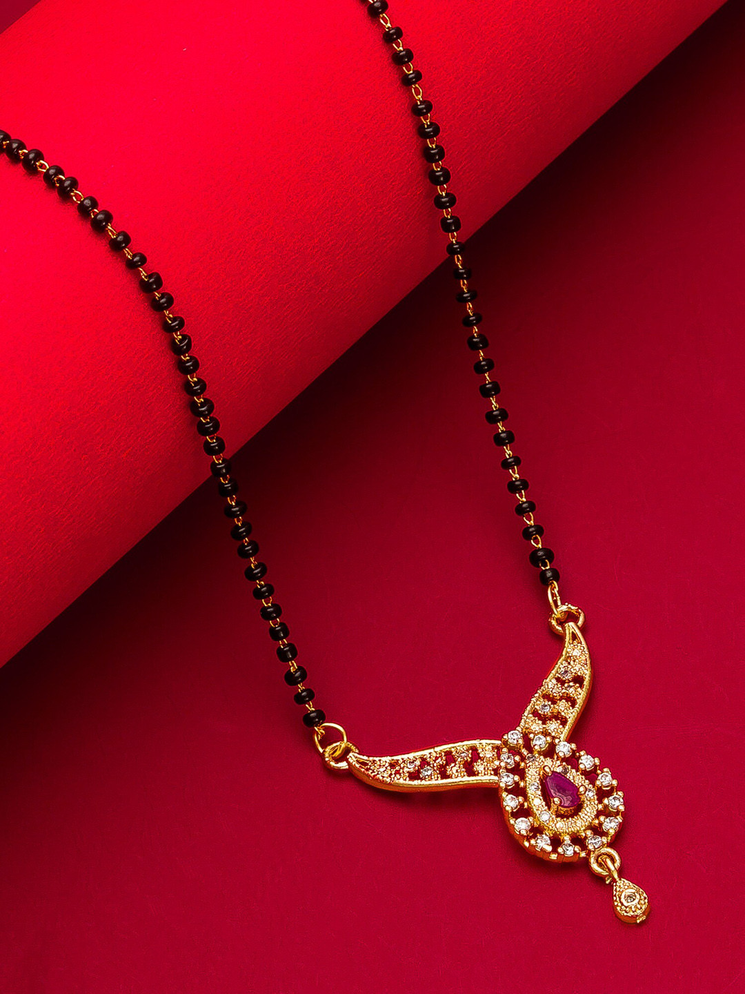 aadita Woman Gold-Plated White Stone & Black Beaded Mangalsutra