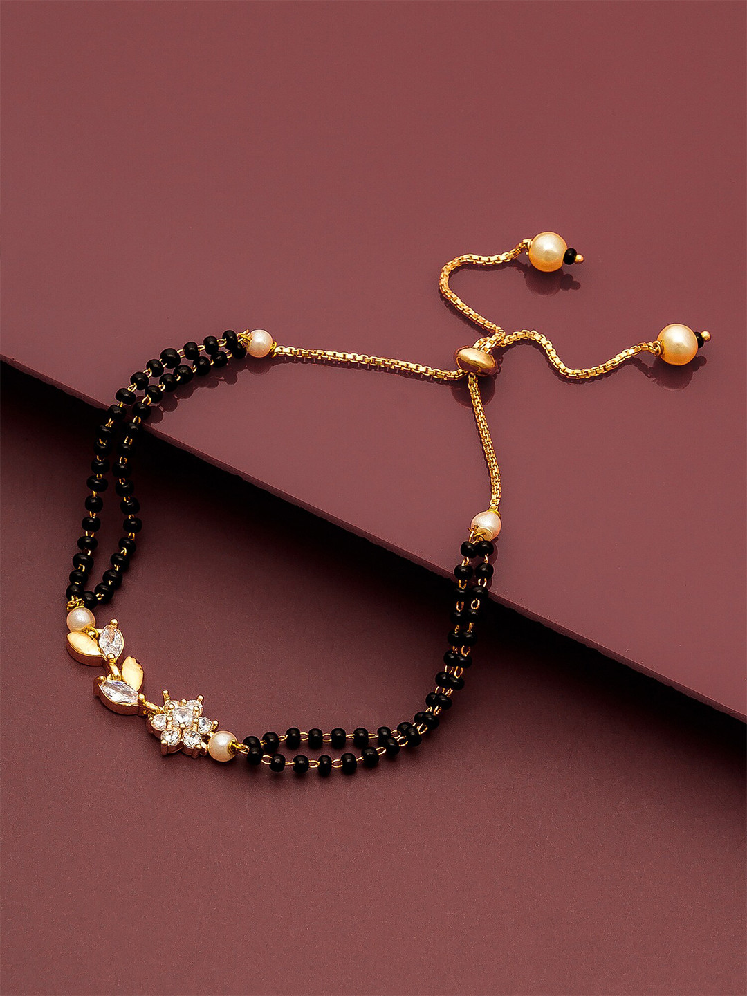 aadita Women Gold-Plated & Black Brass American Diamond Hand Mangalsutra Link Bracelet