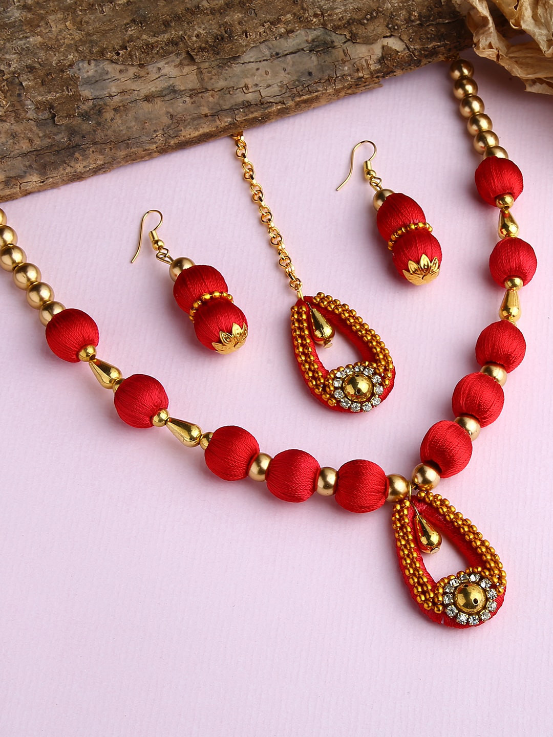 AKSHARA Gold-Plated White  Stone-Studded Red Wooden Balls Silk Thread Jewellery Set