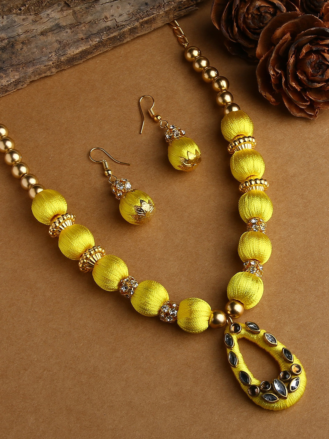 AKSHARA Women Yellow Stone-Studded Wooden Balls Silk Thread Jewelry Set