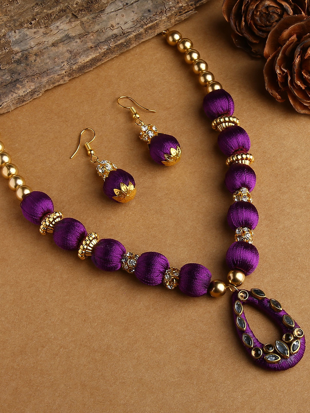 AKSHARA Gold-Toned & Purple Stones-Studded & Beaded Wooden Balls Silk Thread Jewellery Set