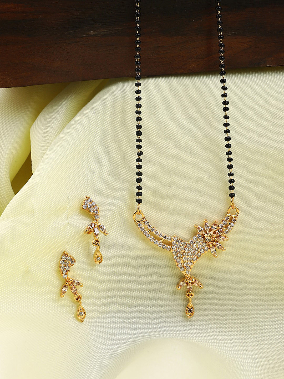 ANIKAS CREATION Gold-Plated & Black Artificial Stones-Studded & Beaded Mangalsutra Set